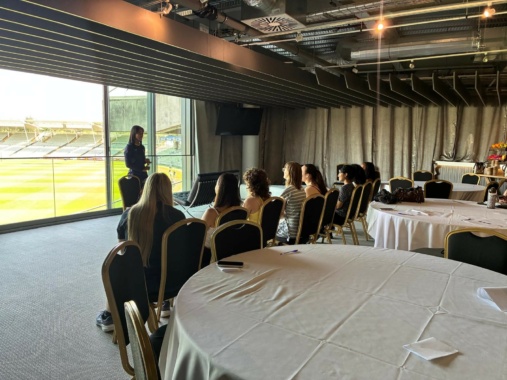 Warwickshire batter Davina Perrin holds a mock press conference with students at Edgbaston